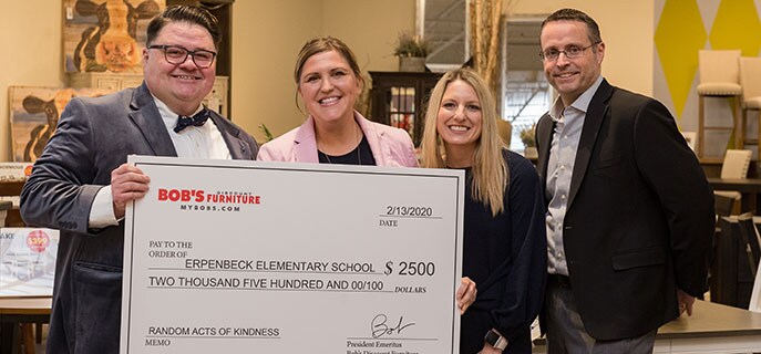 A Random Acts of Kindness check is presented to Erpenbeck Elementary School by Bob's employees