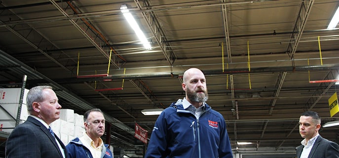 Jesse Douglass, Director of Operations at Bob’s Taftville Distribution Center, shows off the new lights to members of the press and representatives from Norwich Public Utilities, our partner in the lighting upgrade.